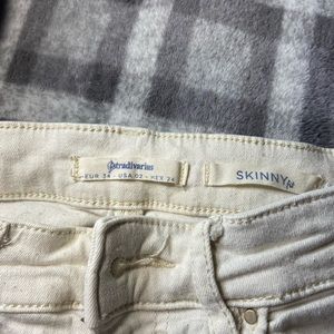 Skinny semi ripped white jeans